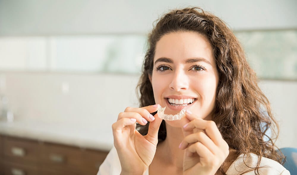 ortodoncia invisible Invisalign solución para los dientes torcidos
